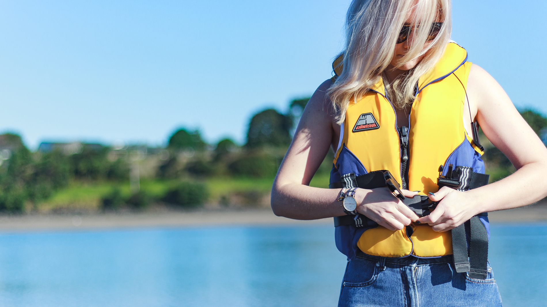 Image - person putting on lifejacket