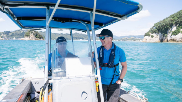 Regional Harbourmaster Chris Bredenbeck (right) on board a moving boat called Kaimahi with Deputy maritime officer Barry King.