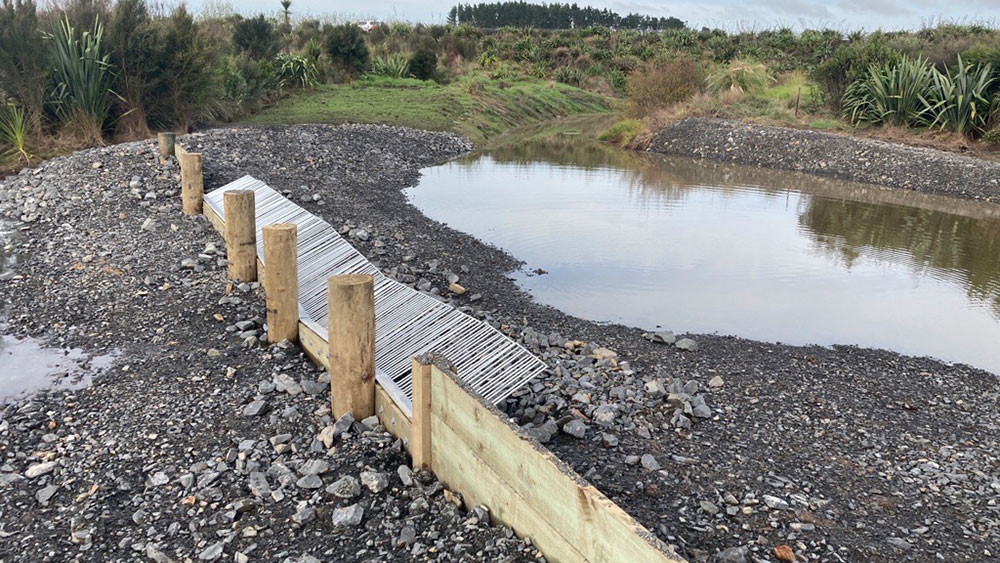 The completed weir with fish screen.